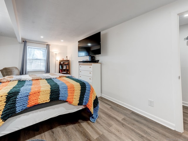 bedroom featuring recessed lighting, baseboards, and wood finished floors