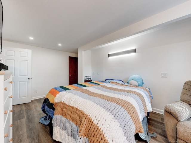 bedroom with recessed lighting, baseboards, and wood finished floors