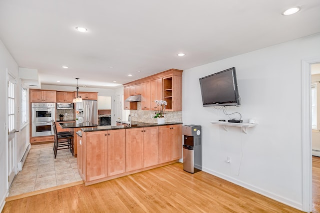 kitchen with a peninsula, open shelves, decorative backsplash, appliances with stainless steel finishes, and under cabinet range hood