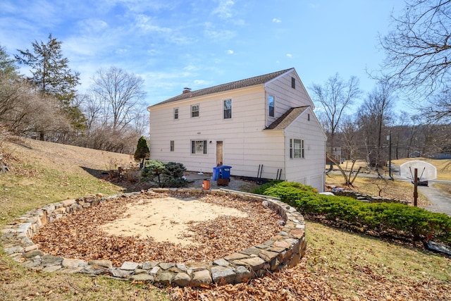 back of property featuring a chimney