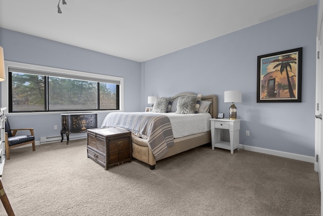 carpeted bedroom featuring baseboards