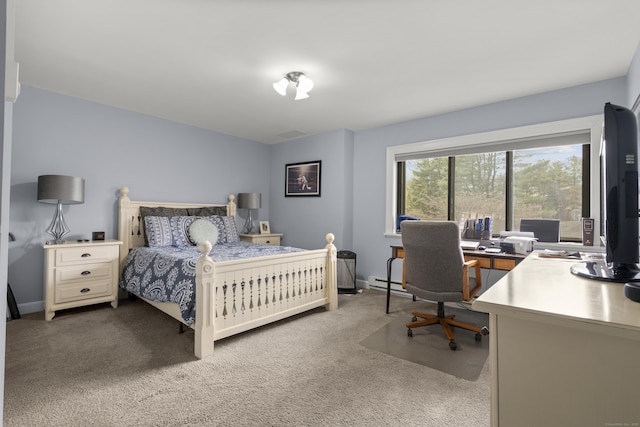 carpeted bedroom featuring baseboards