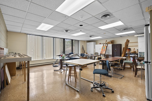 dining area featuring visible vents and a paneled ceiling