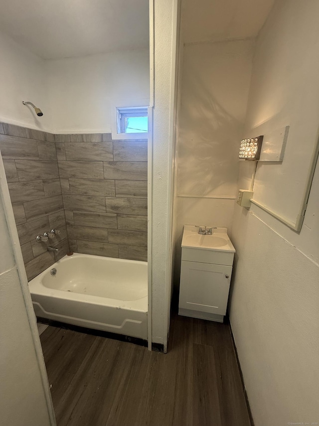 full bathroom with shower / bath combination, wood finished floors, and vanity