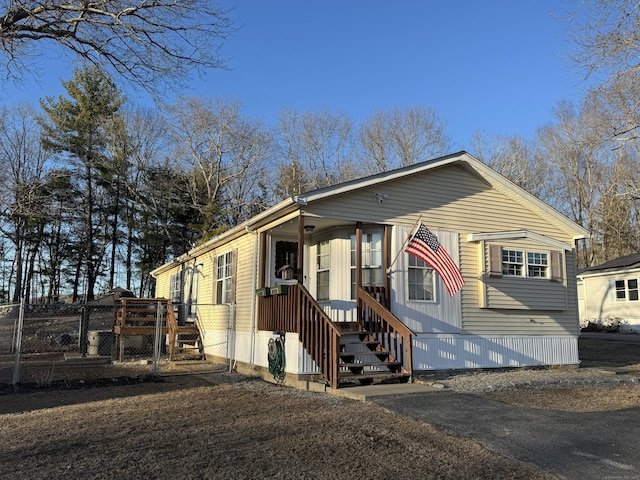 manufactured / mobile home with a gate and fence