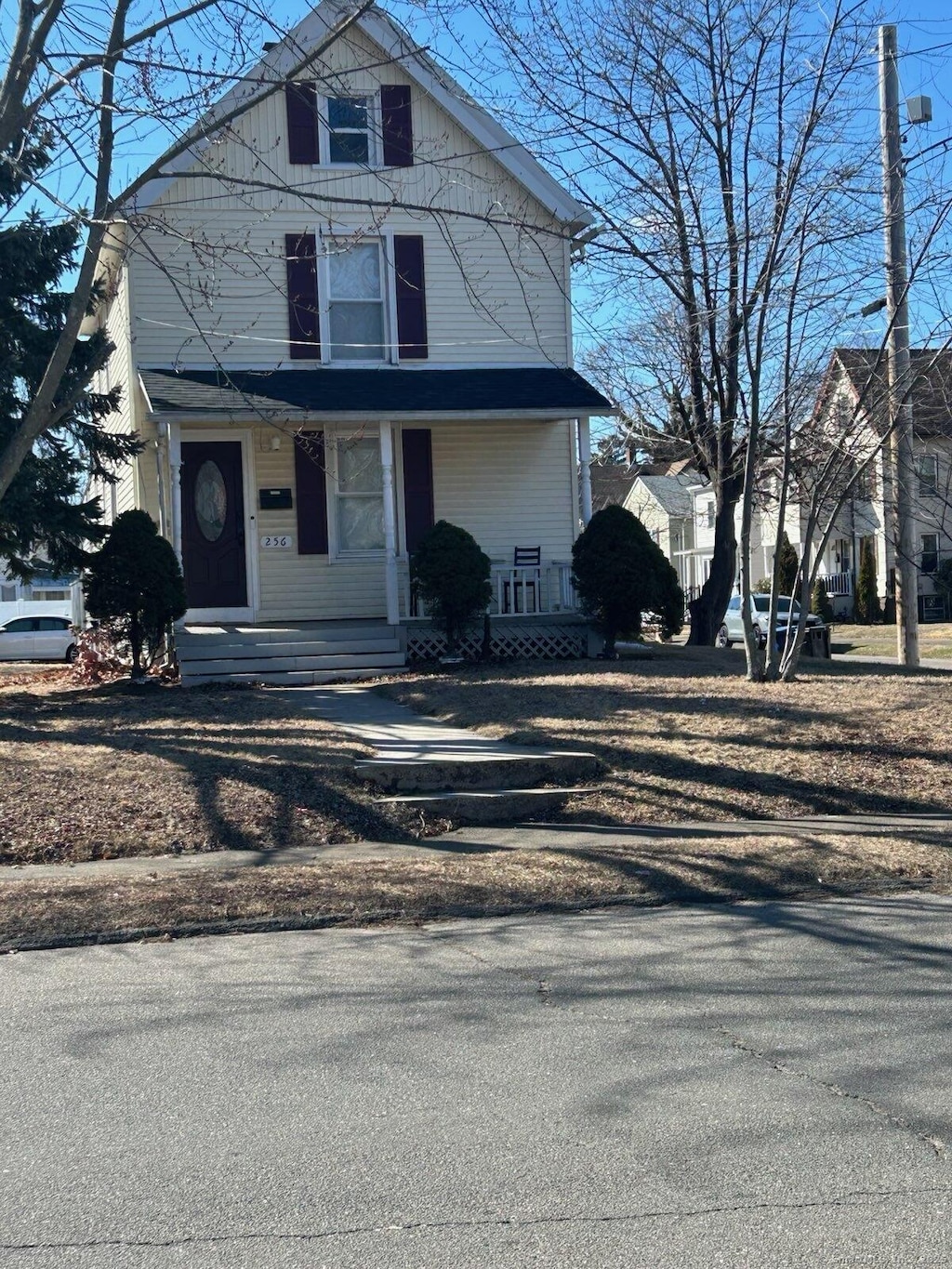 traditional style home featuring covered porch