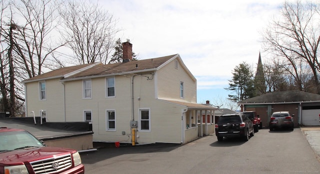 view of side of property with a chimney