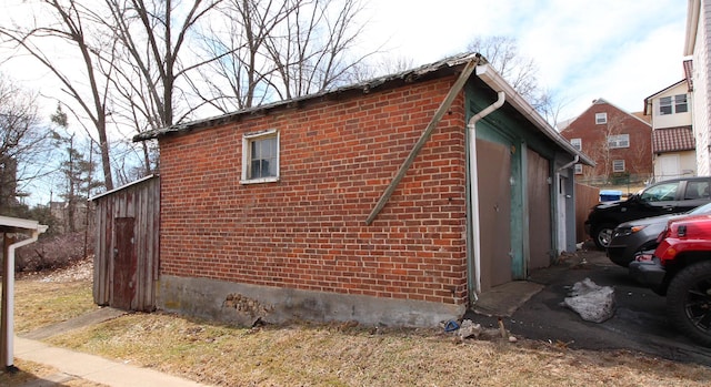 view of side of property with brick siding