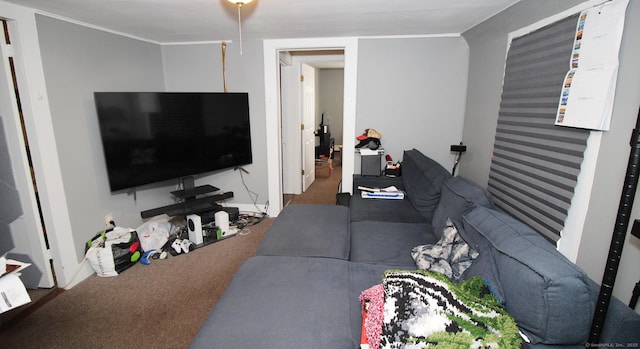 living area with carpet floors and ornamental molding