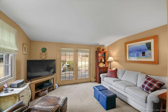 living area with vaulted ceiling and carpet floors