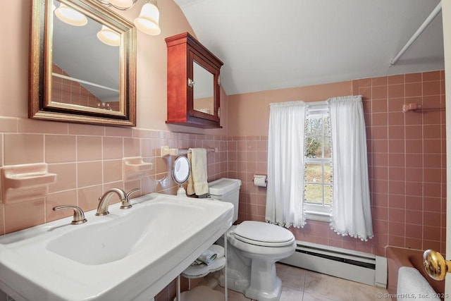 full bath featuring tile patterned floors, toilet, tile walls, baseboard heating, and walk in shower