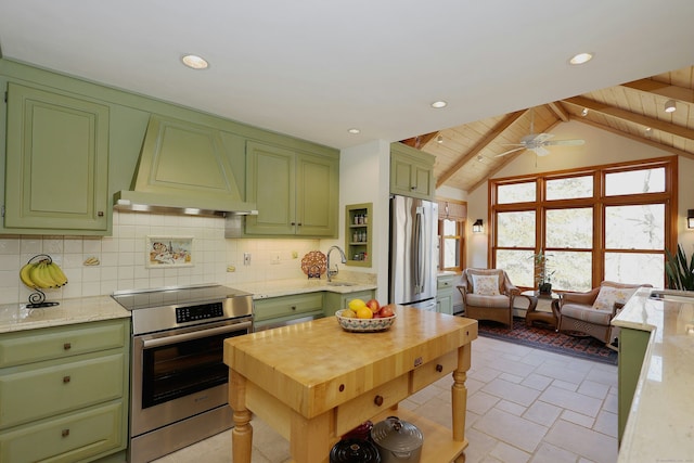 kitchen featuring custom exhaust hood, decorative backsplash, stainless steel appliances, and green cabinets