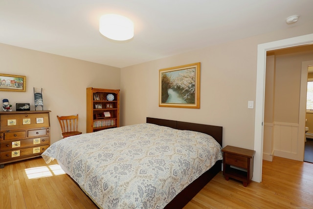 bedroom with light wood-type flooring