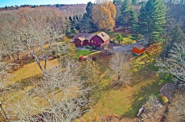 drone / aerial view featuring a forest view