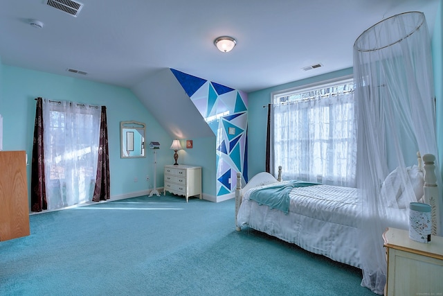 carpeted bedroom featuring visible vents, lofted ceiling, and baseboards