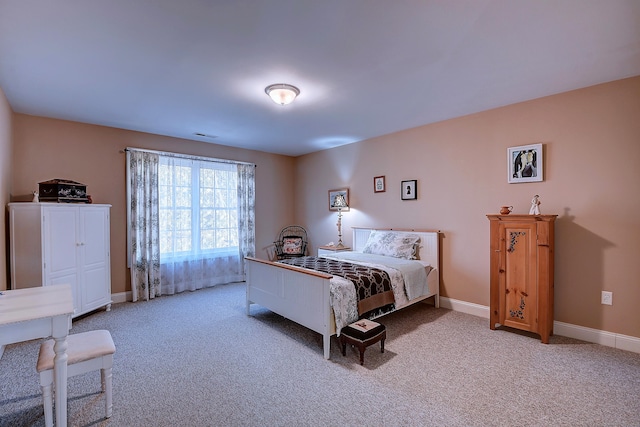 bedroom with visible vents, baseboards, and carpet flooring