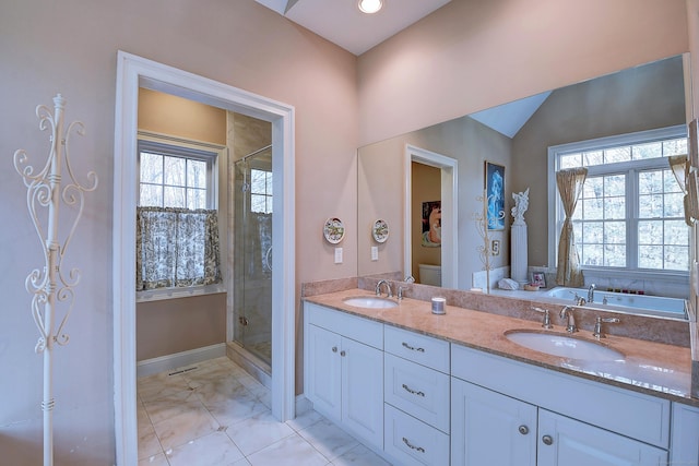 full bath with a sink, toilet, a shower stall, and vaulted ceiling