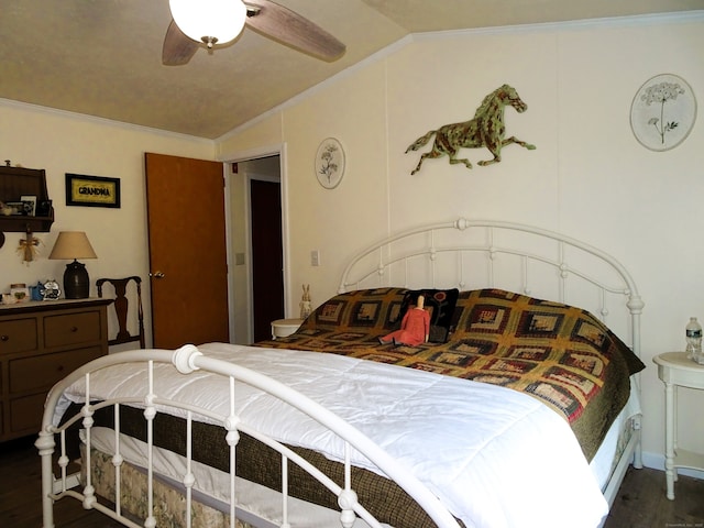 bedroom featuring lofted ceiling, crown molding, dark wood-style flooring, and ceiling fan