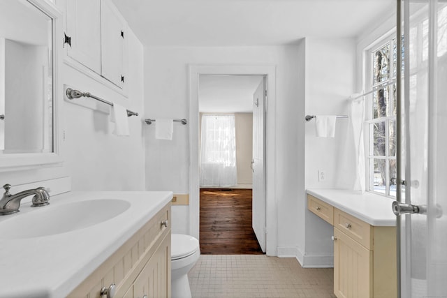 bathroom with toilet and vanity