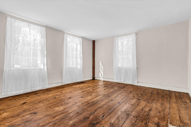 empty room with hardwood / wood-style floors