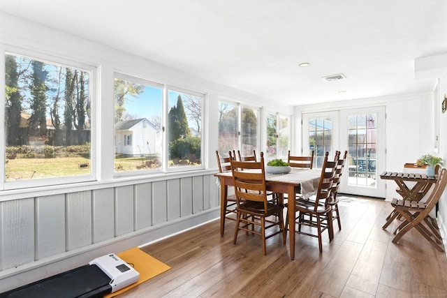 sunroom / solarium featuring french doors and visible vents