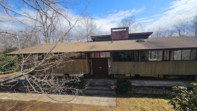 view of front of property with a chimney