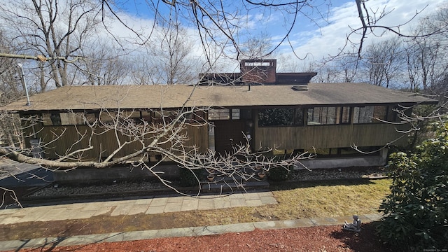 rear view of house with a chimney