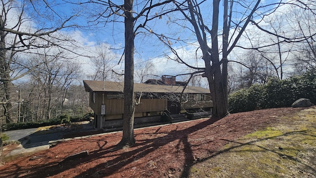 view of side of property featuring a chimney