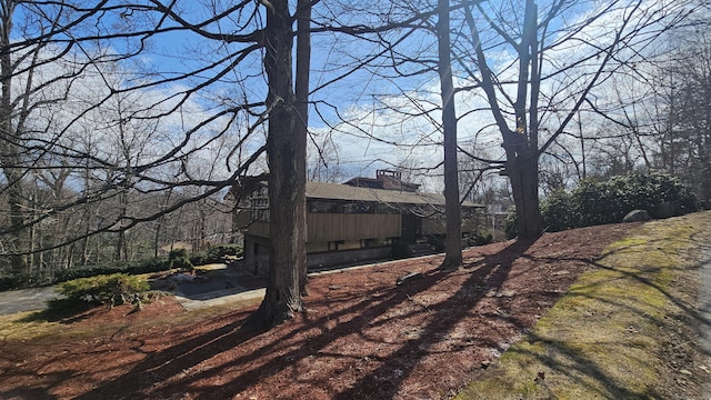 view of home's exterior featuring a chimney