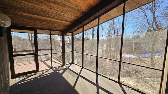 unfurnished sunroom featuring wood ceiling