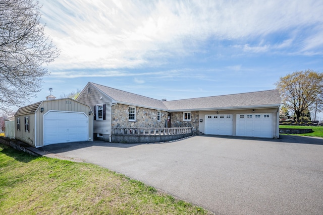 726 Maple St, Rocky Hill, CT 06067 - ranch-style house featuring a garage, stone siding, aphalt driveway, and fence
