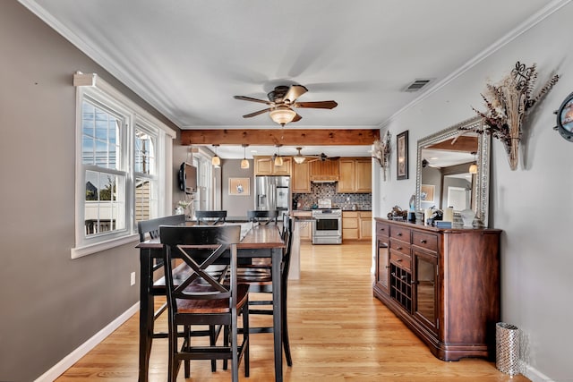 726 Maple St, Rocky Hill, CT 06067 - dining area featuring light wood-style flooring, baseboards, visible vents, ceiling fan, and crown molding