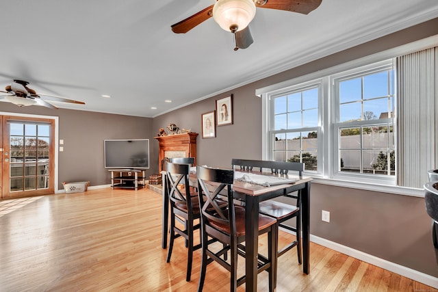 726 Maple St, Rocky Hill, CT 06067 - dining area with light wood finished floors, a ceiling fan, a wealth of natural light, and ornamental molding