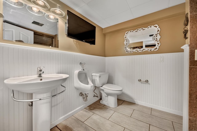 726 Maple St, Rocky Hill, CT 06067 - bathroom featuring wainscoting, toilet, and tile patterned floors
