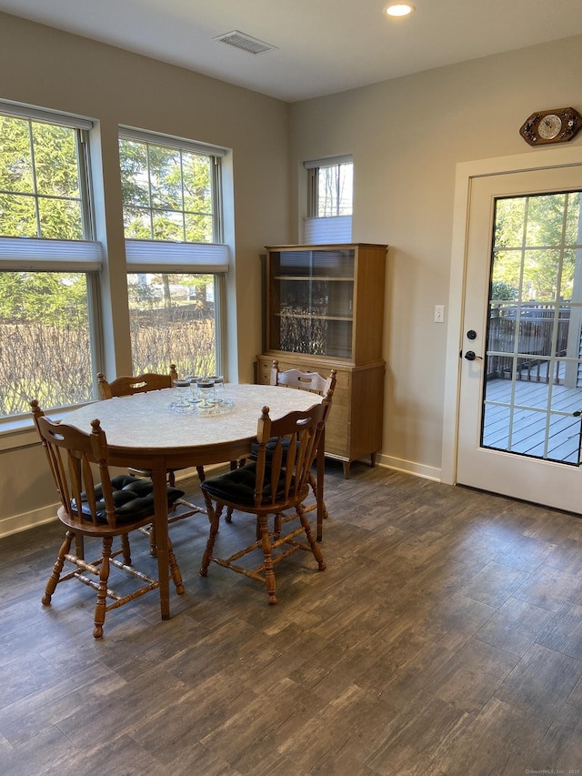 dining area with recessed lighting, baseboards, and dark wood-type flooring