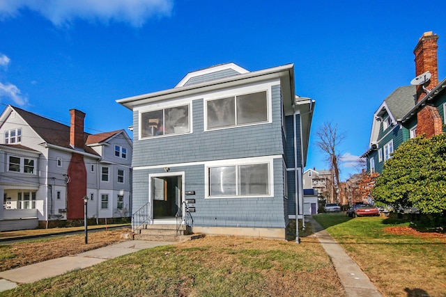 view of front of property with a front lawn