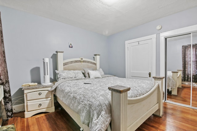 bedroom with a closet and wood finished floors