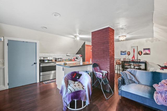 living area with lofted ceiling, a toaster, and dark wood-style floors