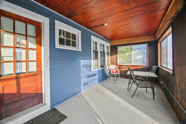 sunroom / solarium featuring wooden ceiling