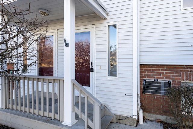 view of exterior entry with brick siding