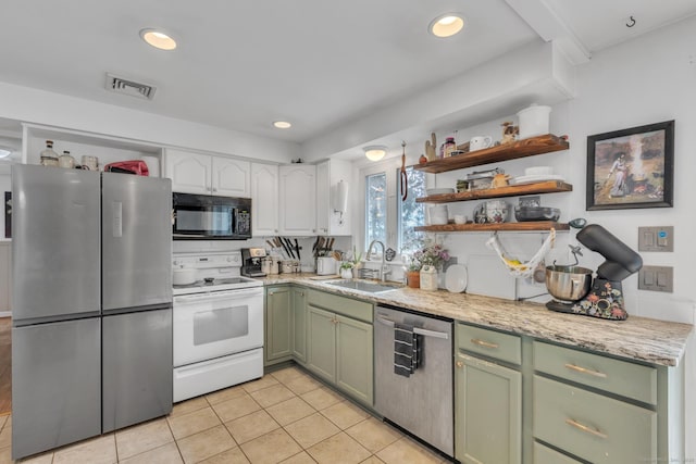 kitchen with visible vents, open shelves, a sink, appliances with stainless steel finishes, and green cabinetry