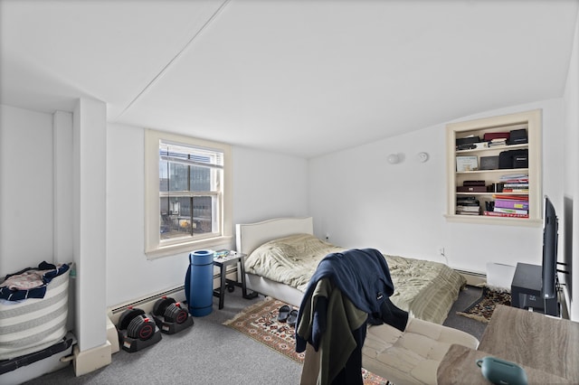 carpeted bedroom featuring baseboard heating and a baseboard heating unit