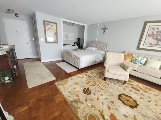 bedroom with a closet and baseboards