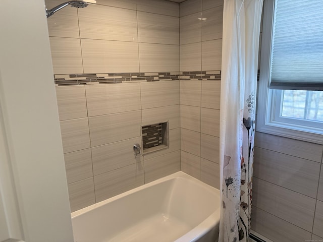 full bathroom featuring shower / tub combo and a baseboard radiator