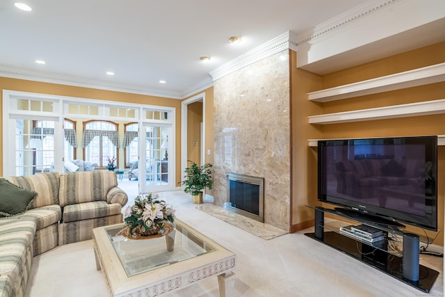 carpeted living room featuring crown molding, recessed lighting, baseboards, and a premium fireplace