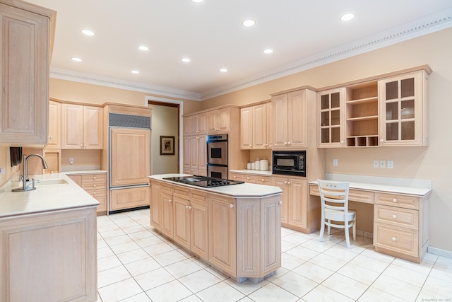 kitchen featuring black appliances, light brown cabinetry, a sink, a center island, and light countertops