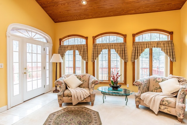 tiled living room featuring vaulted ceiling, plenty of natural light, and wood ceiling