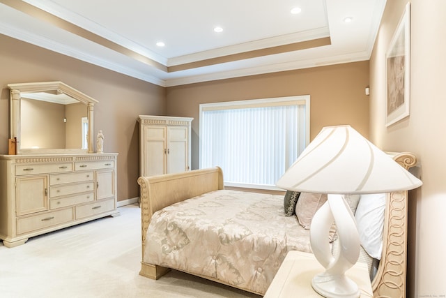 bedroom with baseboards, light colored carpet, a tray ceiling, ornamental molding, and recessed lighting