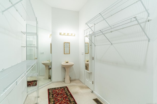 bathroom with visible vents, baseboards, and a sink