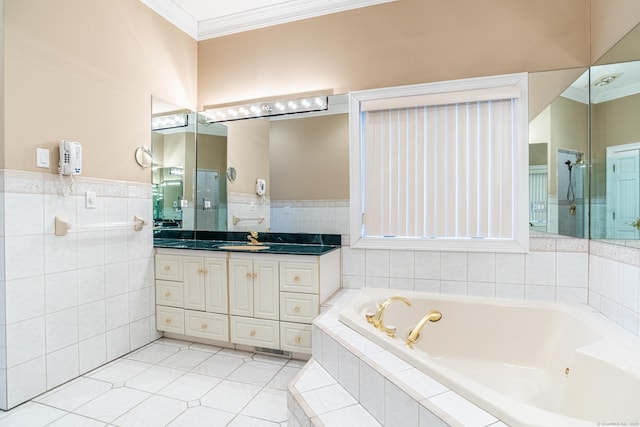 bathroom featuring tile patterned floors, tile walls, a tub with jets, crown molding, and vanity